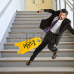 56588013-mature-hispanic-businessman-falling-down-the-stairs